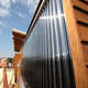 U.S. Energy Secretary Steven Chu tours the University of Maryland's entry in the U.S. Department of Energy Solar Decathlon, followed by students Scott Tjaden, left, and Jeff Rappaport, second from left, in Washington, D.C., Friday, Sept. 30, 2011. (Credit: Stefano Paltera/U.S. Department of Energy Solar Decathlon)